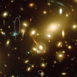 [Abell 2218, with lenses of the most distant galaxy circled]